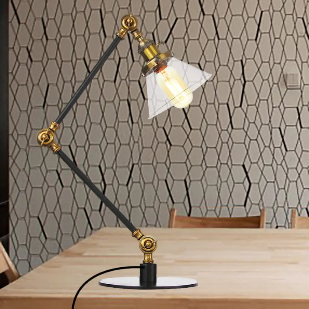 Lámpara de mesa industrial con brazo ajustable y pantalla de cristal transparente - Acabado negro/latón
