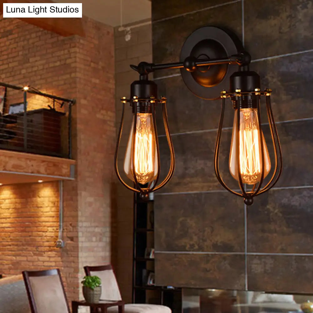 Lámpara de pared ajustable de hierro negro - Jaula con forma de bombilla, estilo industrial, ideal para leer en el dormitorio