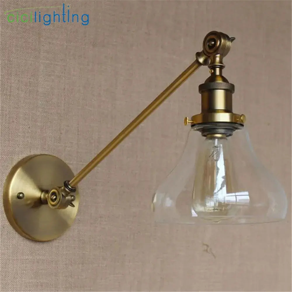 Adjustable brass wall sconce with clear glass dome and exposed filament bulb for bedroom wall lamp decorbites brass copper