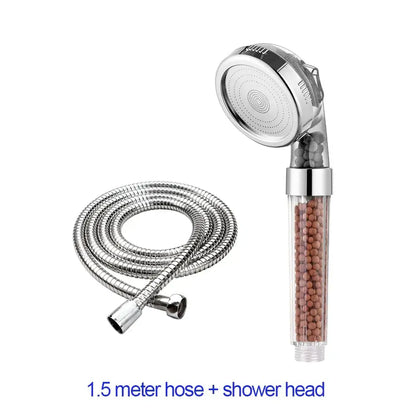 Adjustable high pressure silver shower head with transparent cylindrical body containing brown filter beads and chrome hose