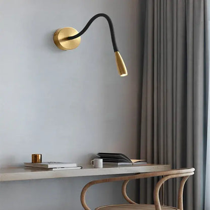 Adjustable nordic bronze wall lamp with gold finish, black flexible gooseneck arm, and adjustable light head by decorbites