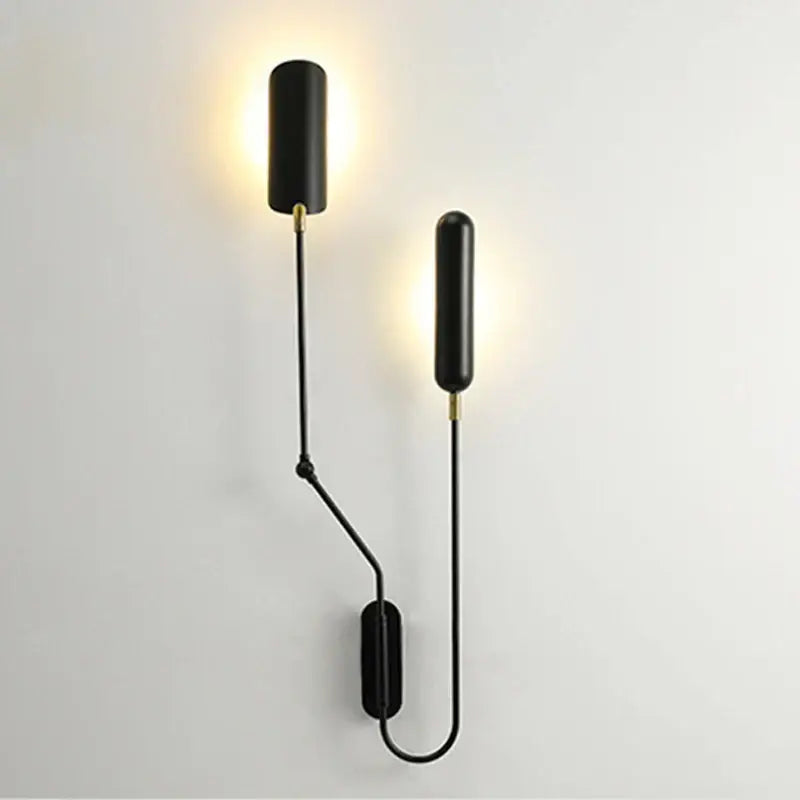 Black cylindrical wall lamp with gold accents and articulated arms decorbites adjustable retro wall light for bedroom reading