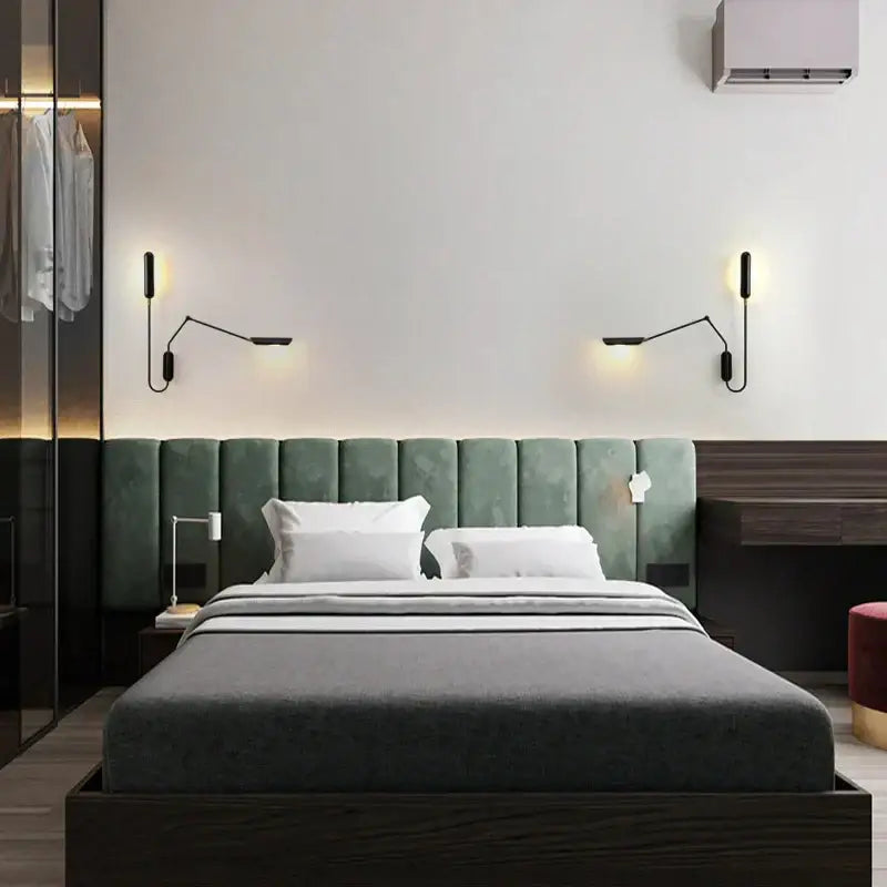 Adjustable retro wall lamp in black metal mounted above green velvet tufted headboard with dark wood frame decorbites wall lamp