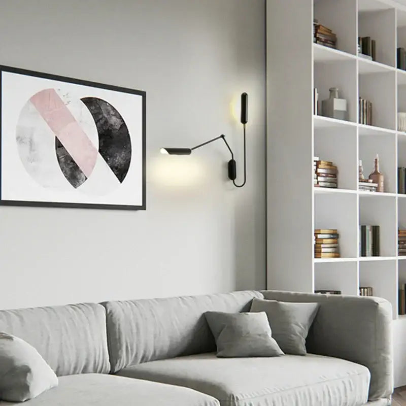 Black minimalist adjustable retro wall lamp by decorbites with slender articulated arm and warm bedroom reading light