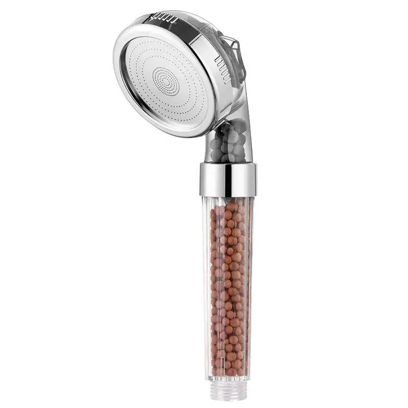 Adjustable shower head with chrome finish and transparent filter housing containing brown filtration beads for bathroom use
