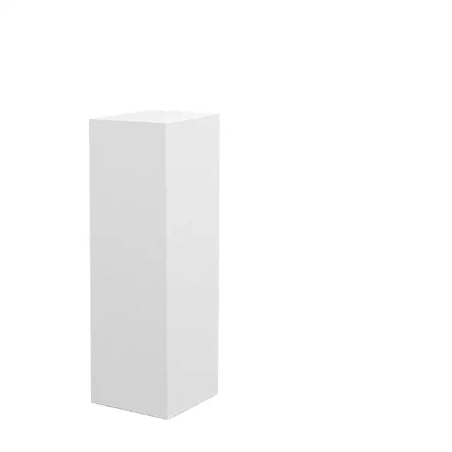 A sleek white rectangular display pedestal showcasing an adjustable shower head with chrome accents and filter beads