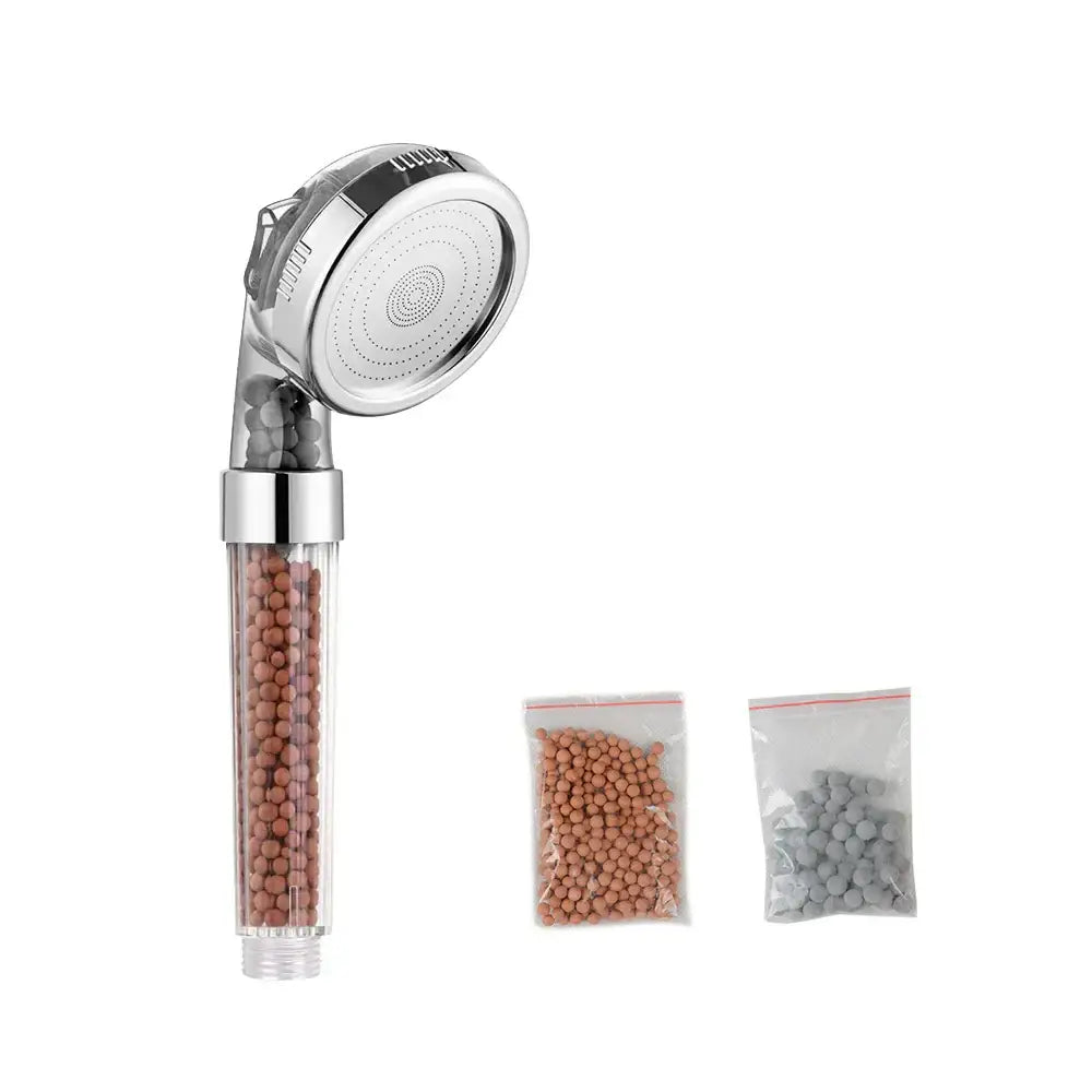 Adjustable shower head with chrome finish and transparent body containing brown filter beads for bathroom use