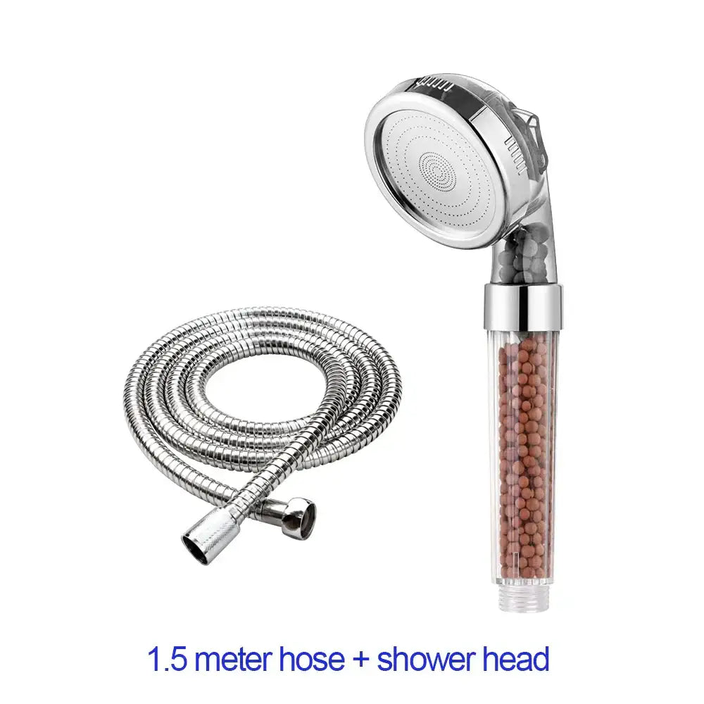 Adjustable shower head with chrome accents, transparent body containing brown filter beads, and flexible chrome hose