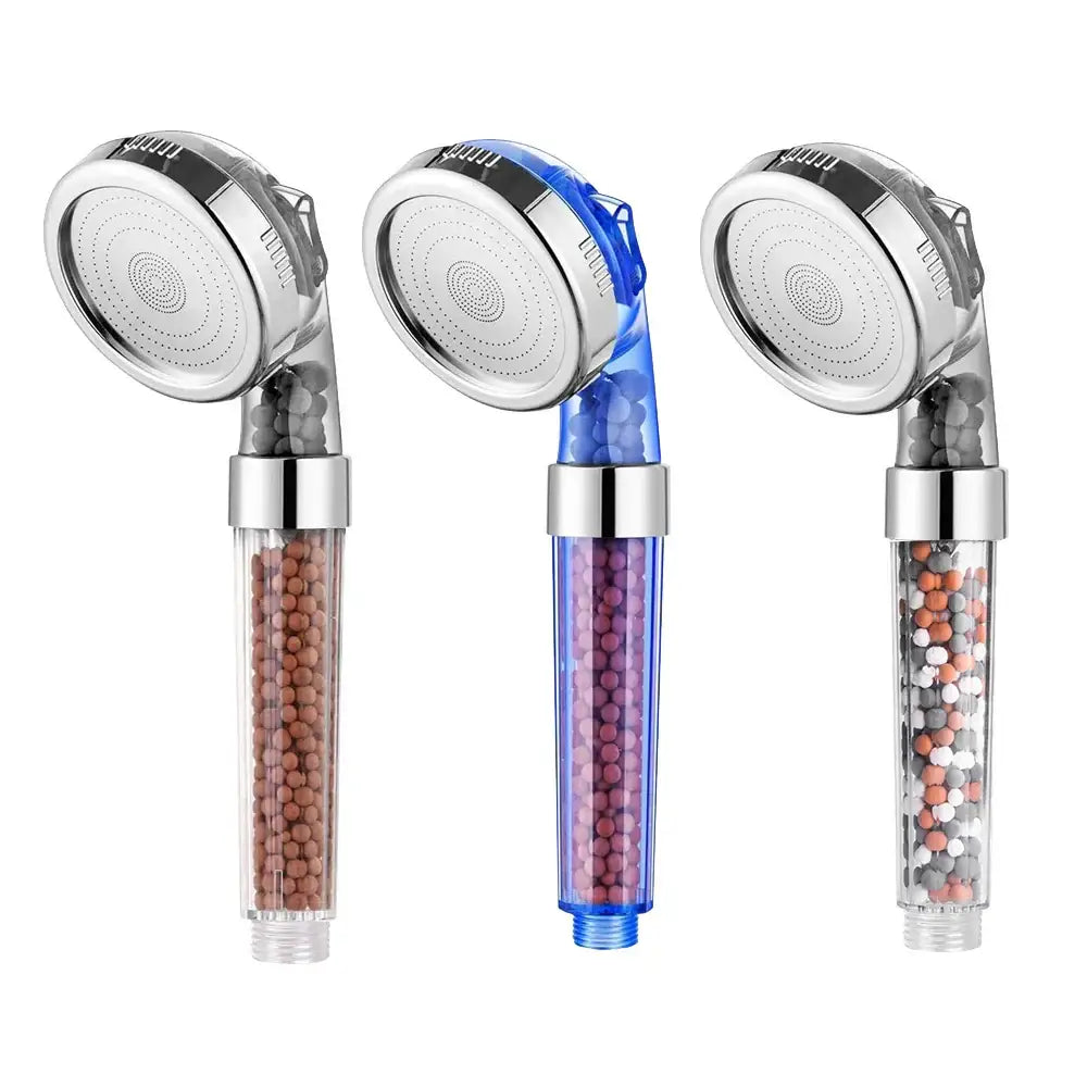 Three transparent adjustable shower heads with chrome accents and colorful internal filter beads for bathroom use