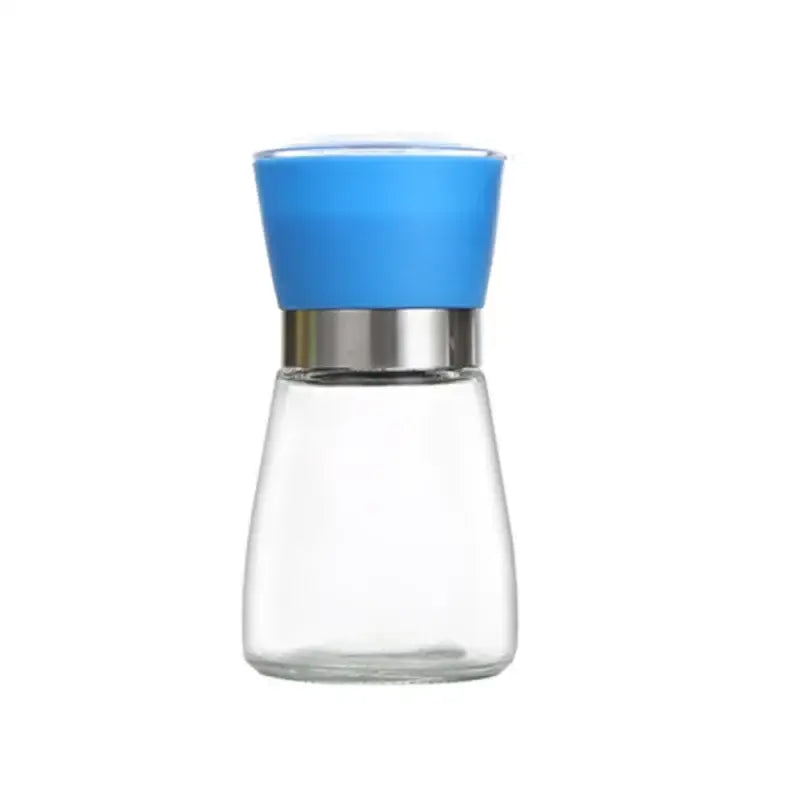 Adjustable spice grinder with clear glass body bright blue silicone top and metallic silver band for kitchen use