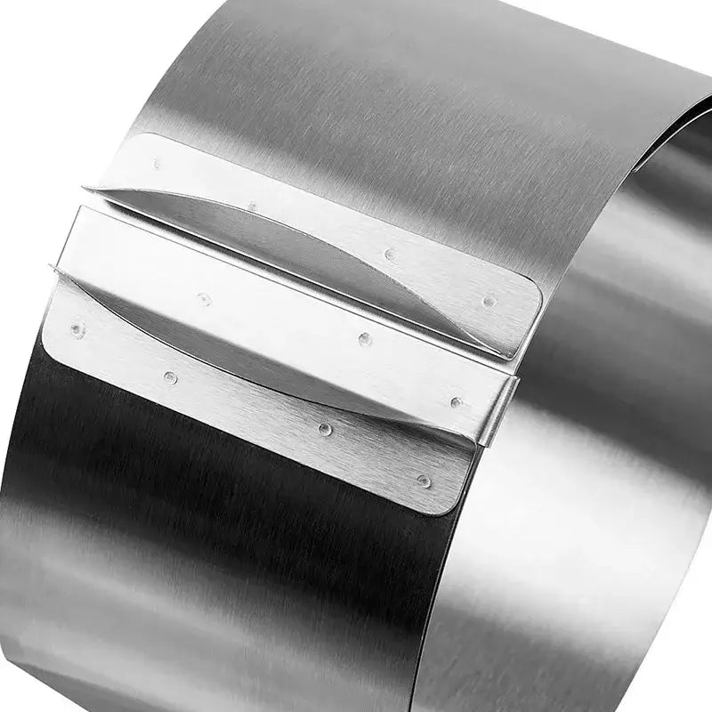 Adjustable stainless steel mousse ring round with sleek brushed finish and three horizontal bars for cake slicer use