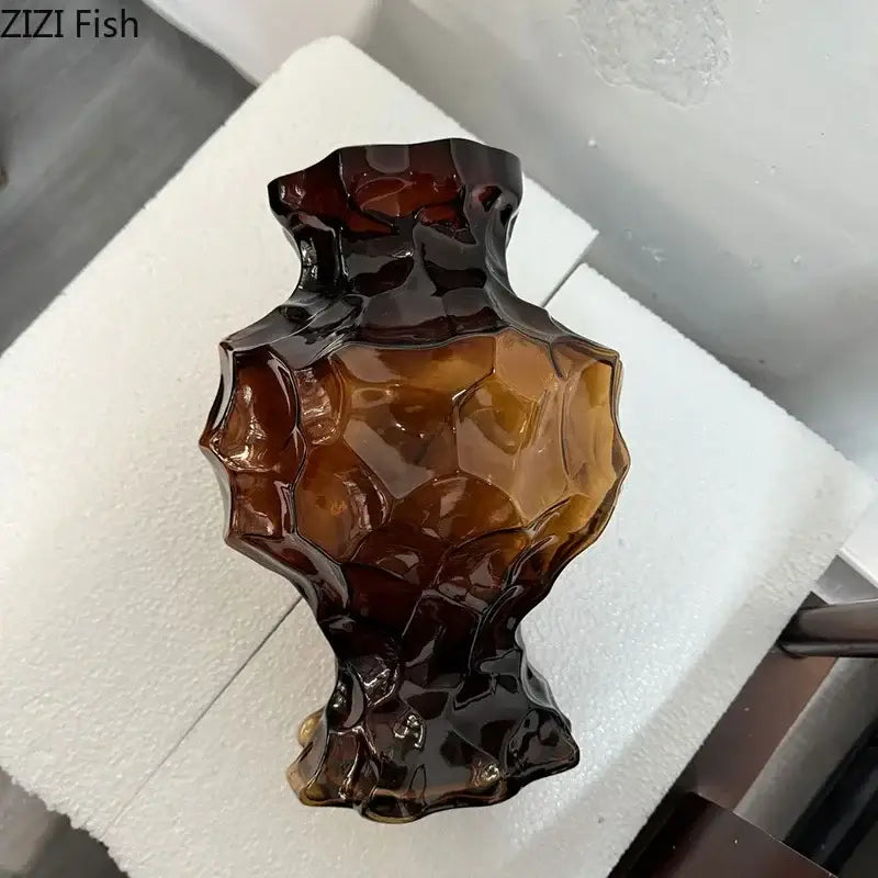 Aesthetic amber irregular glass vase with glossy faceted design and dark brown base for bedroom decorbites irregular glass