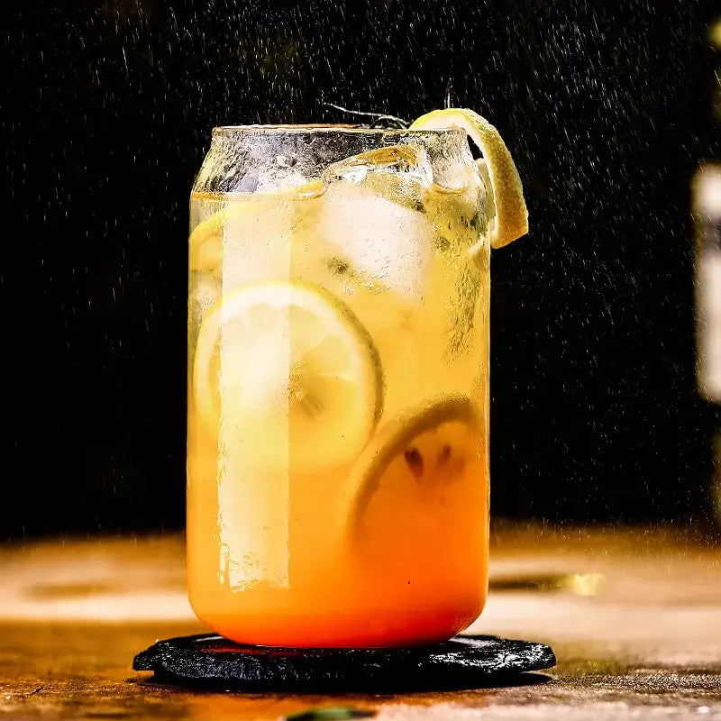 Aesthetic drinking glasses set with lids and straws featuring a clear glass jar filled with lemon beverage and ice cubes