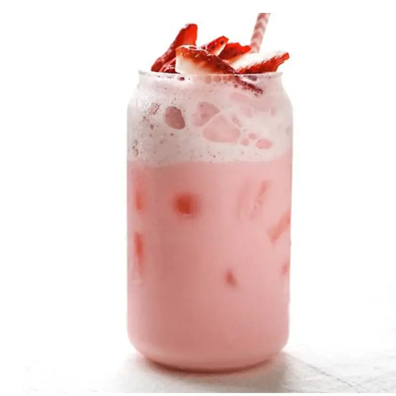 Aesthetic drinking glasses set featuring a clear glass can with a pink strawberry milkshake topped with whipped cream and strawberries