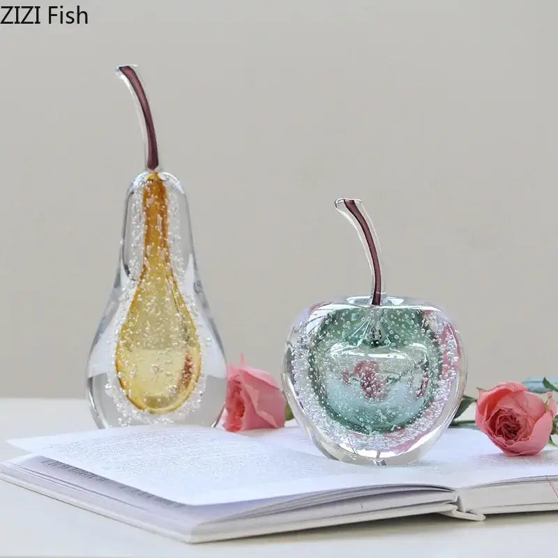 Aesthetic green and gold glass fruit sculpture desk ornament featuring amber bubble pear and teal interior apple with dark stems