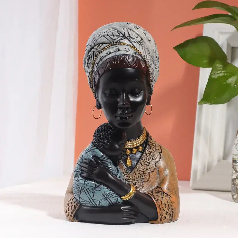 A glossy black resin african exotic black mother and child figurine with white headwrap and gold jewelry for decorbites living room decor