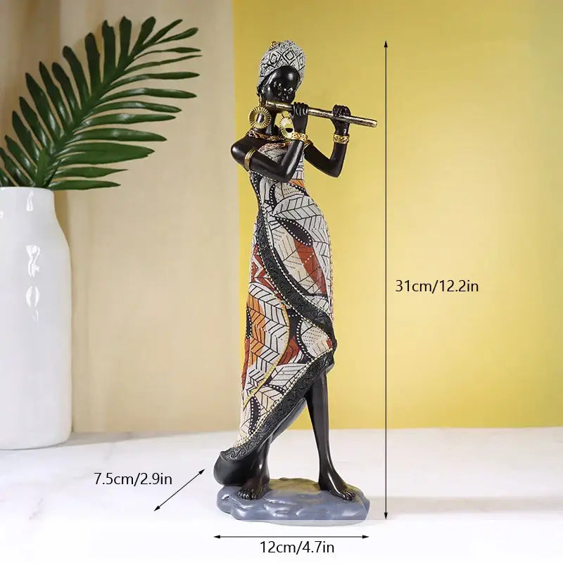 African exotic black mother and child figurines featuring intricate geometric patterns and gold-toned accessories for decorbites african exotic living room decor