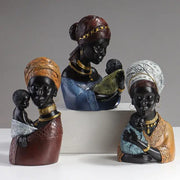 Three intricately detailed resin african mother child figurines with gold jewelry and patterned headwraps for ethnic decorbites decor
