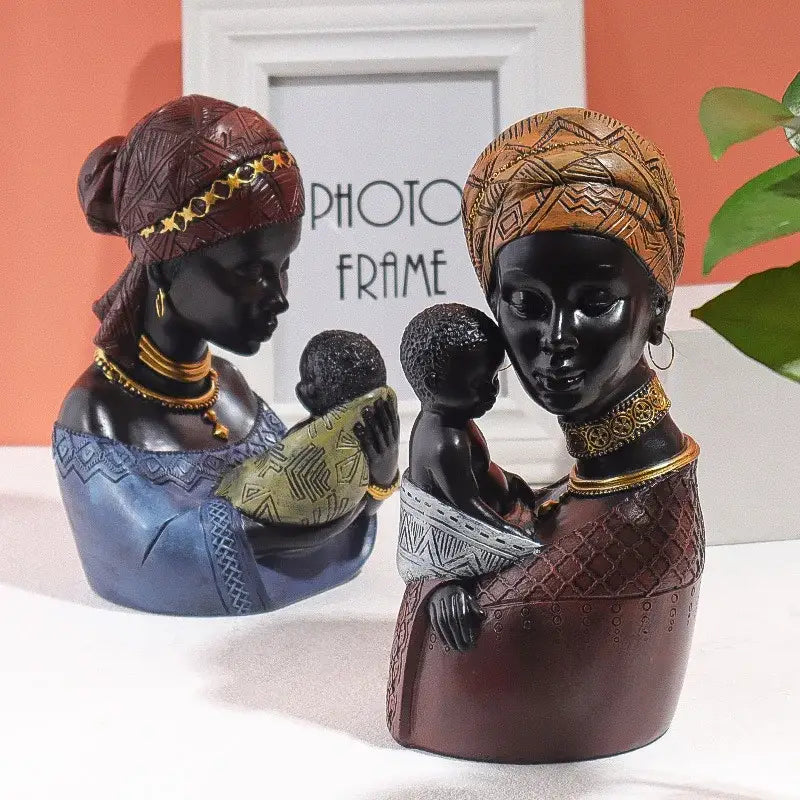 Two african mother child abstract resin figurines in maroon and orange traditional attire for ethnic living room decorbites decor