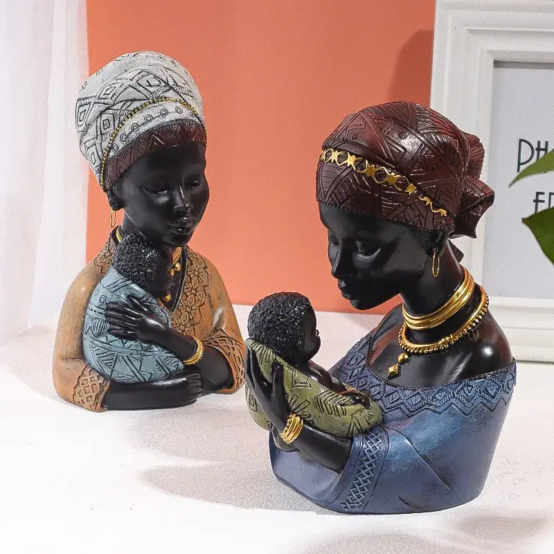 Two intricately detailed african mother child abstract resin figurines with white headwrap and brown gold headdress decorbites decor