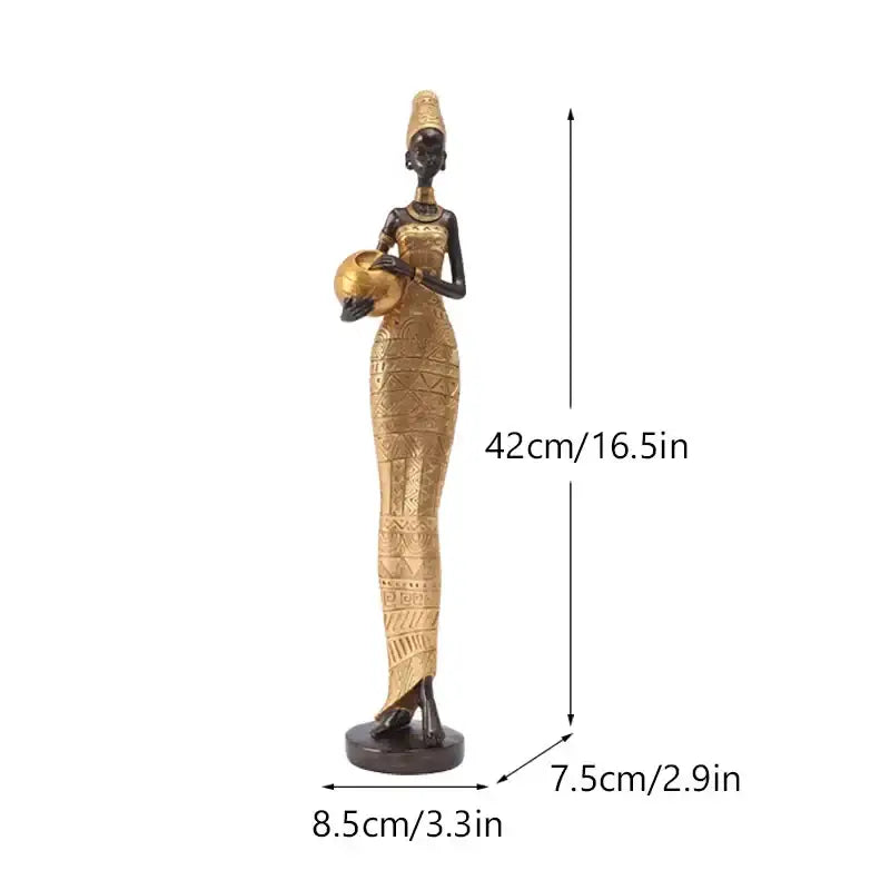 Tall slender black woman resin figurine with gold accents wearing patterned dress holding golden bowl for decorbites decor