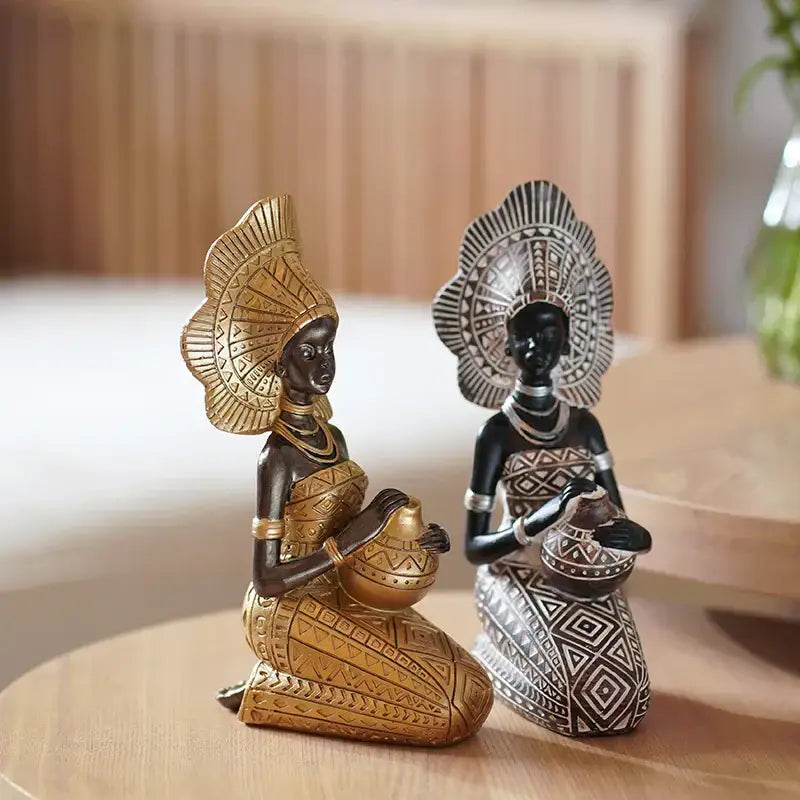 Two african style black woman resin figurines in gold and black-white with intricate patterns for living room decorbites decor