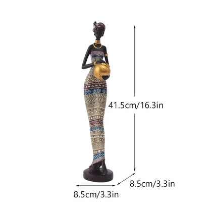 A tall black woman resin figurine with gold accents and detailed patterned dress for decorbites living room decor
