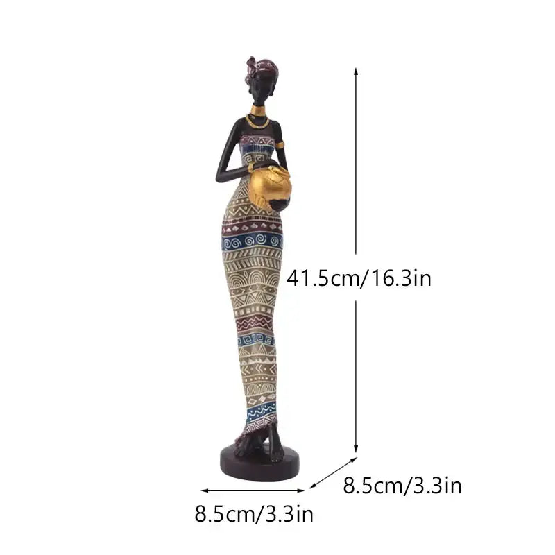 A tall black woman resin figurine with gold accents and detailed patterned dress for decorbites living room decor