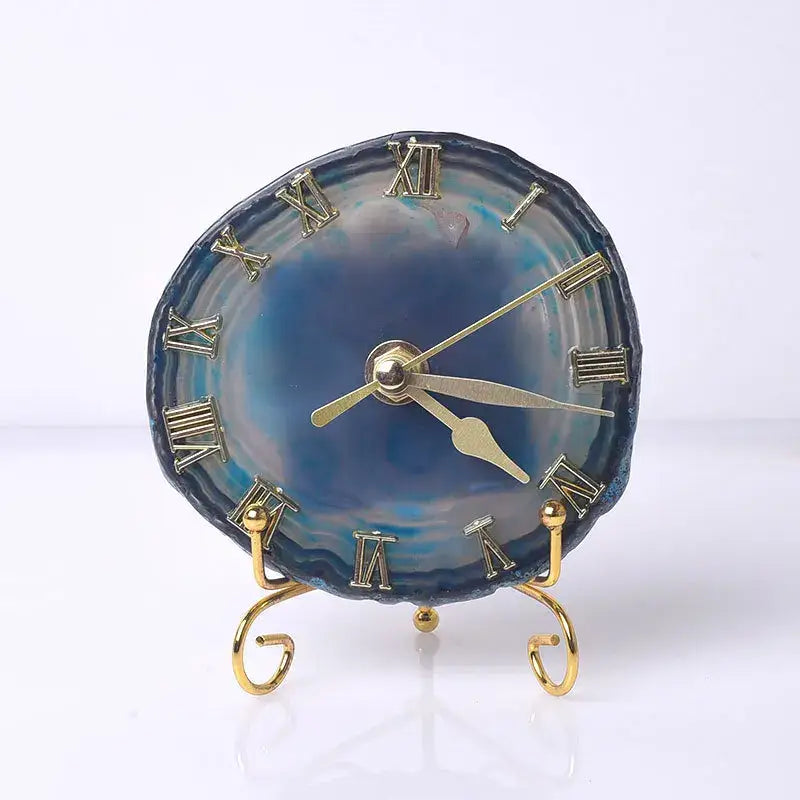 Blue agate stone clock with gold roman numerals and hands on a decorative golden stand for luxury living room decorbites decor