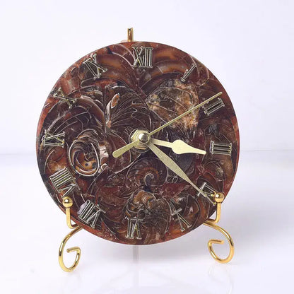 A decorative brown marble agate stone clock with gold roman numerals and floral relief for luxury living room decor