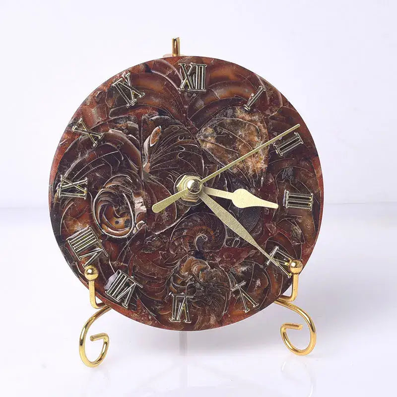 A decorative brown marble agate stone clock with gold roman numerals and floral relief for luxury living room decor