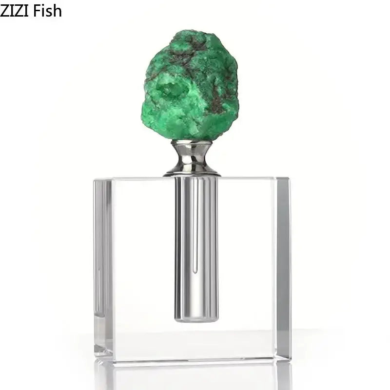 A clear acrylic agate stone perfume bottle with silver neck and green gemstone stopper for essential oils decor