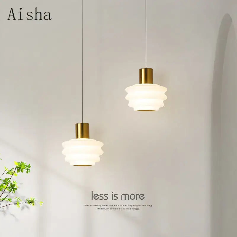 Two elegant aisha pendant lights with frosted glass shades and gold-finished metal fixtures for bedroom decorbites acrylic led decor