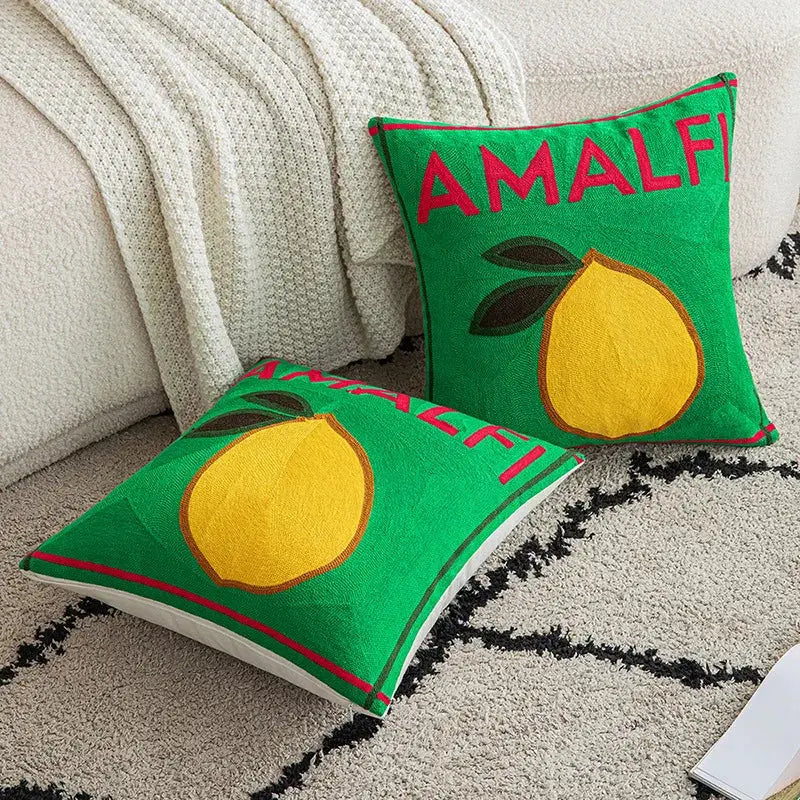 Green embroidered cushion cover featuring a yellow lemon, amalfi text in red, and brown leaf accents for living room use