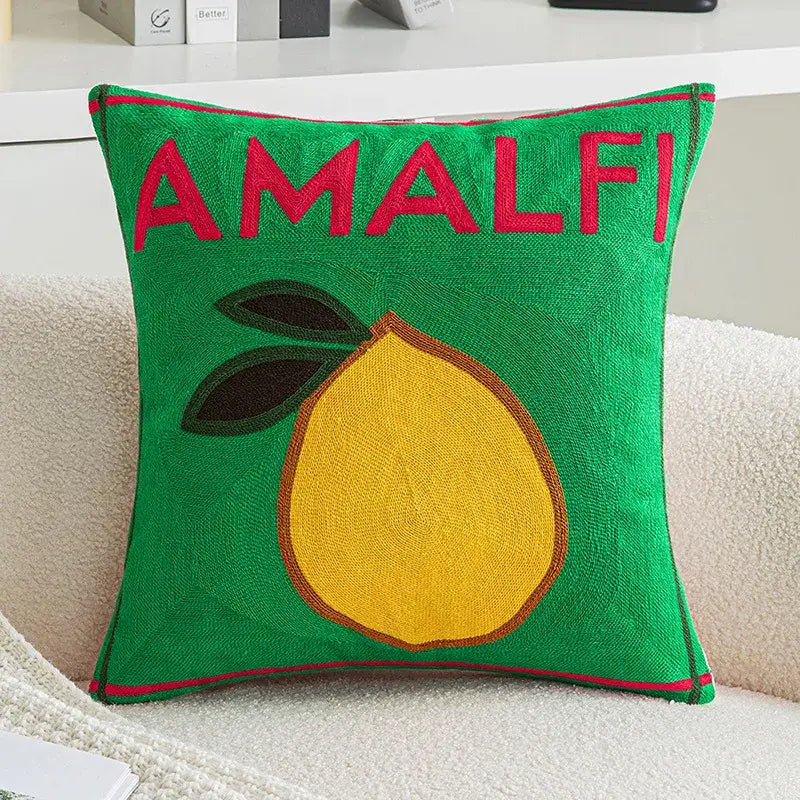Green embroidered lemon cushion cover featuring the word amalfi in red with yellow lemon and red piping for living room use