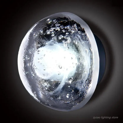 Clear textured glass orb wall lamp with frosted white center and dark crystalline patterns decorbites crystal led wall lamp