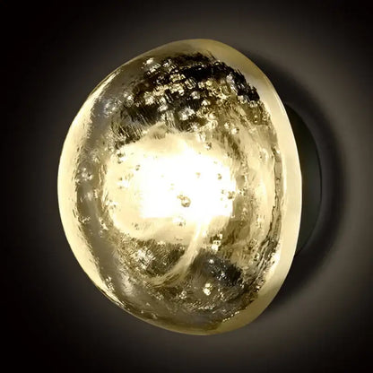 A warm amber and gold textured crystal led wall lamp with swirling patterns for bedroom decorbites crystal led decor