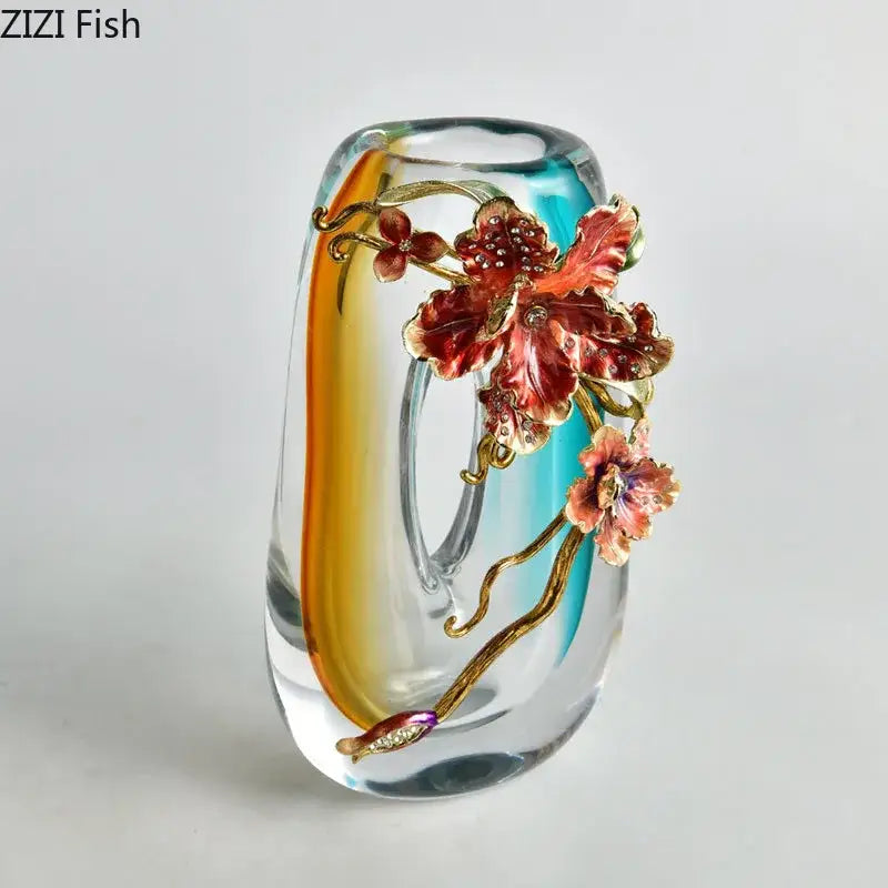 A translucent glass vase with an amber and blue gradient glass featuring red and gold enamel flowers for living room decor