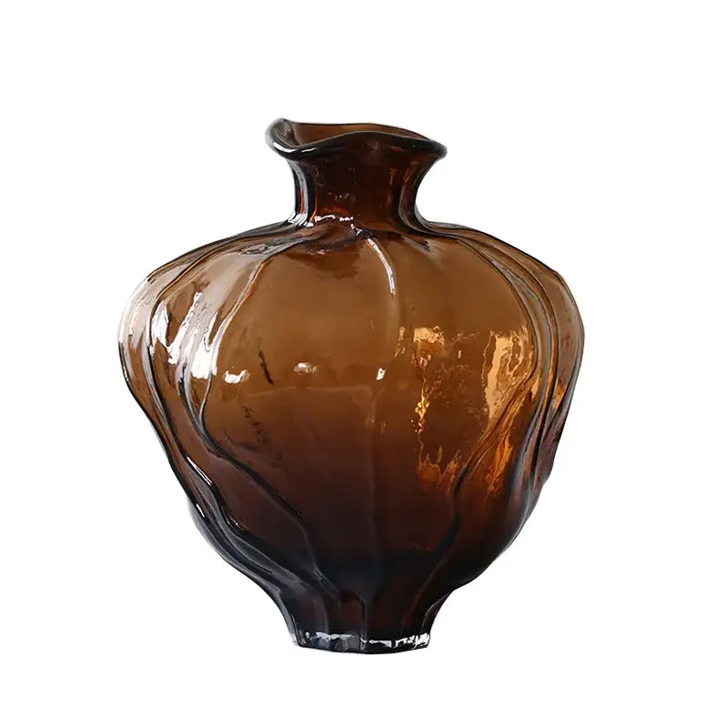 A translucent amber brown wavy grain glass pumpkin vase with a fluted body and irregular rim for living room decorbites decor