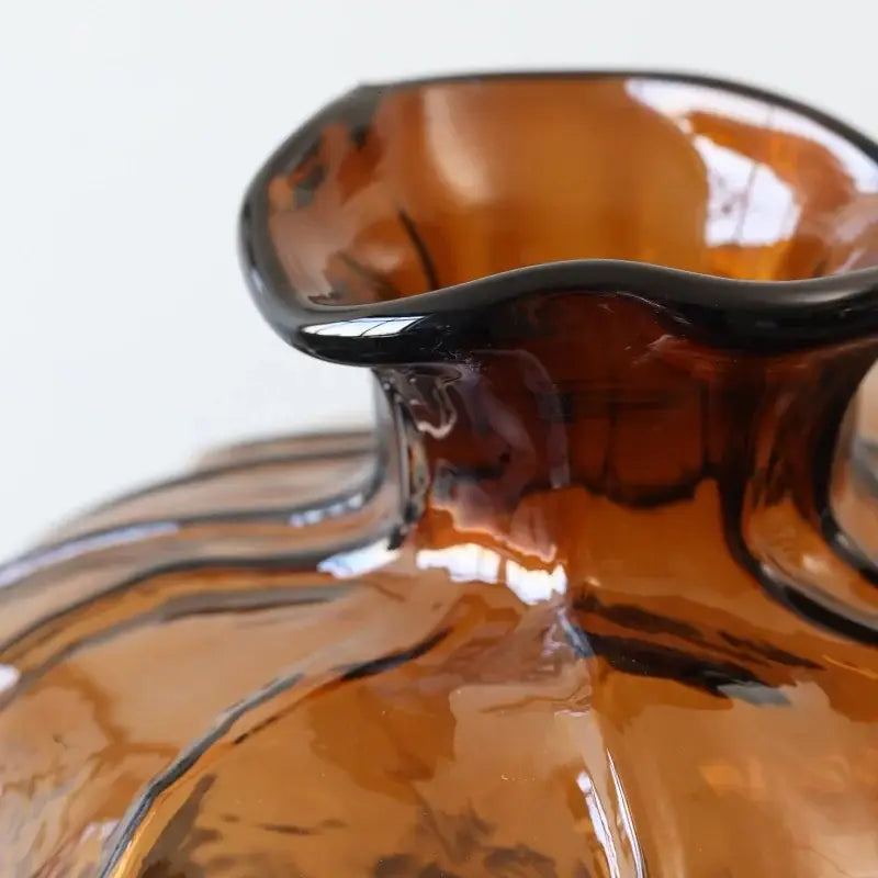 Amber glass pumpkin vase with glossy wavy grain rim and subtle swirling patterns for living room decorbites brown wavy decor