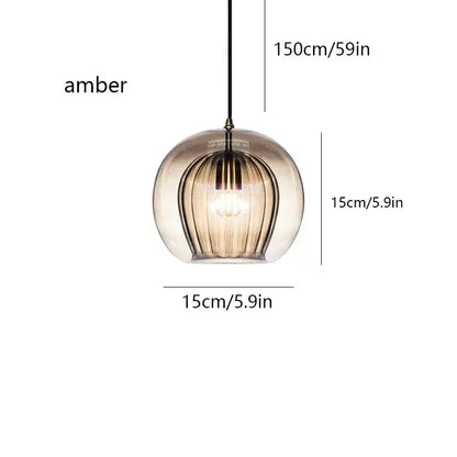 Amber-colored glass pendant light with vertical ribbed texture and black cord for kitchen gold globe cord pendant