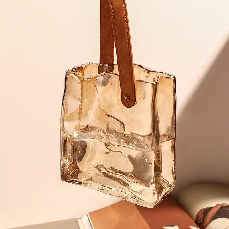Transparent amber bag shape glass vase with brown leather handle for living room decor in crinkled amber glass