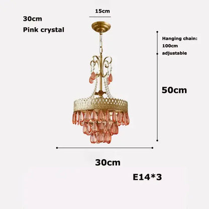 A delicate pink decorbites crystal water drop chandelier with gold metal frame and adjustable chain for dining room