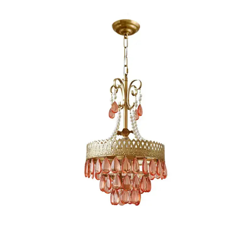 Amber crystal water drop chandelier features gold-toned tiers with peach glass teardrops and white pearls for elegant decorbites crystal water drop lighting