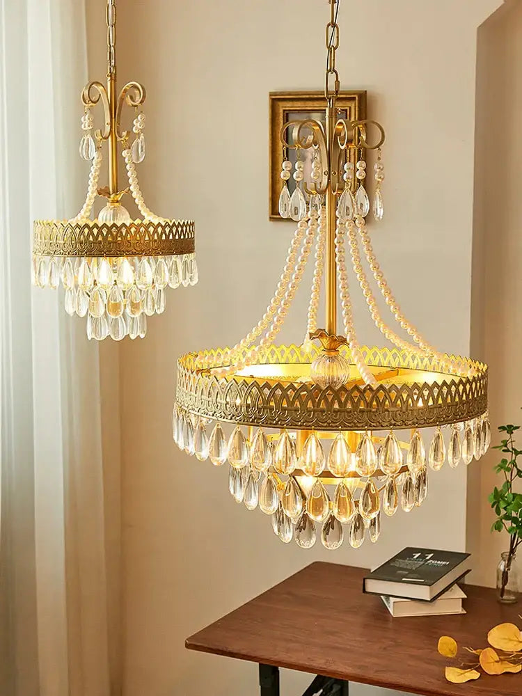 Gold-toned amber crystal water drop chandelier with intricate filigree and cascading clear crystal teardrops for dining room decorbites crystal water drop pendant light