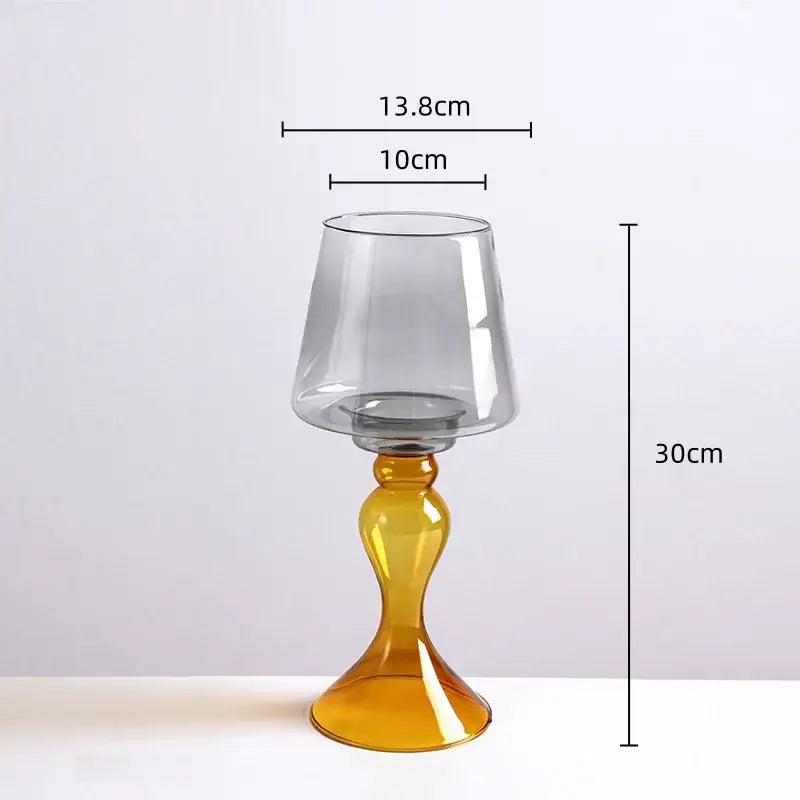 A tall slender candle holder with amber base and gray tinted top from decorbites geometric glass vase collection