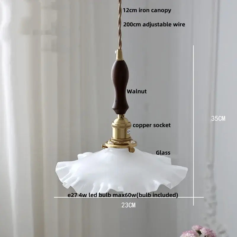 Amber flower glass pendant light with white ruffled edge, walnut handle, and brass hardware for dining room pendant lights