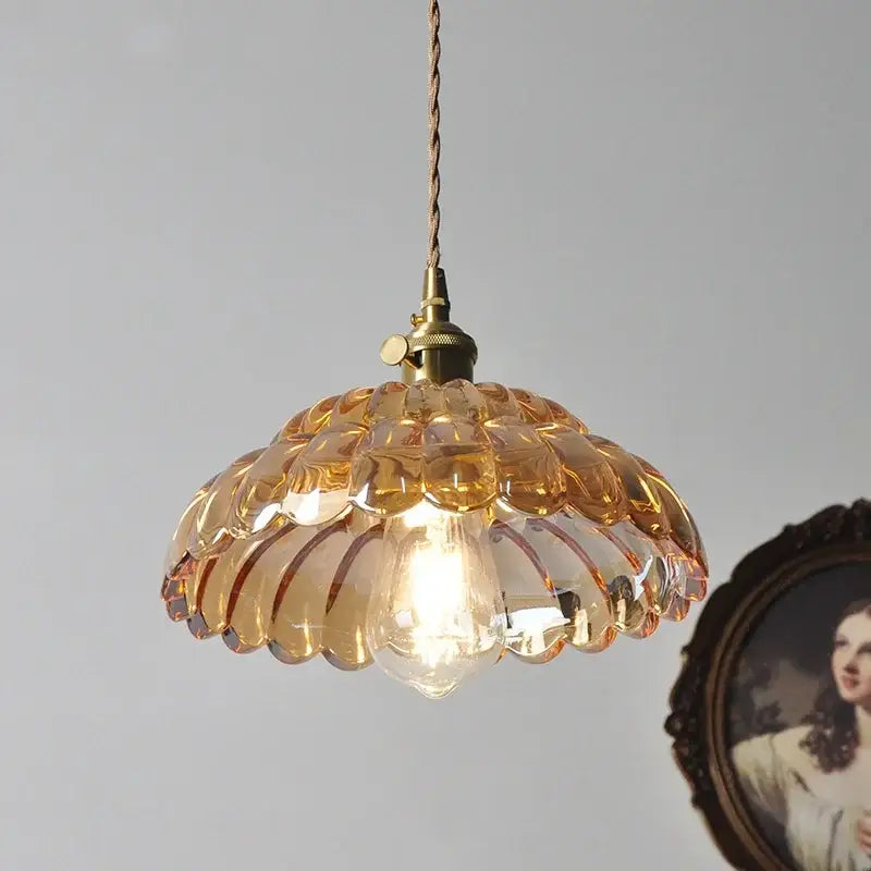 Amber flower glass pendant light with scalloped petal design and brass finish for dining room pendant lights