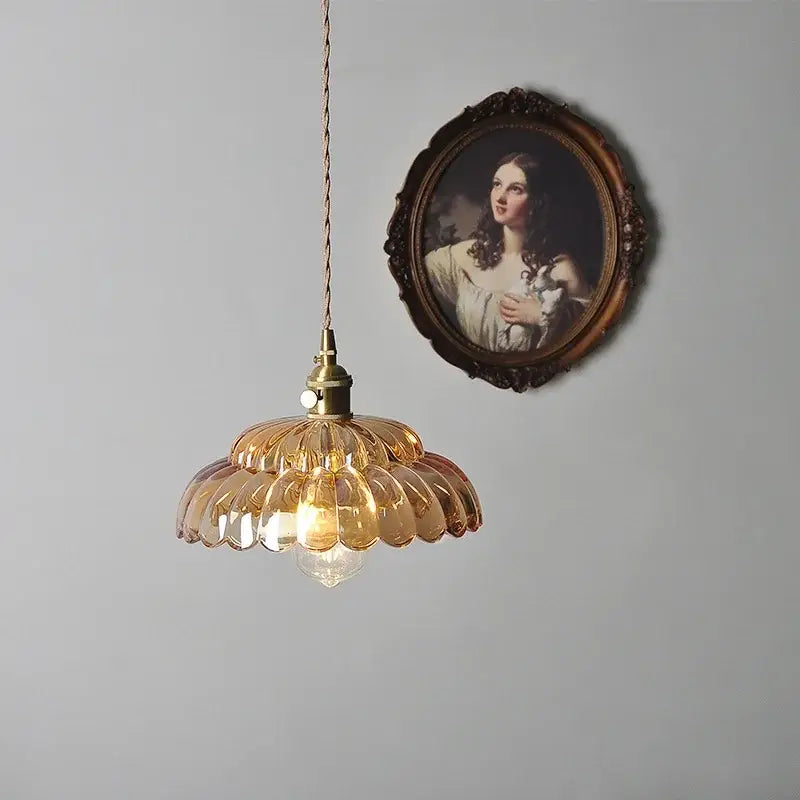 Amber flower glass pendant light with warm amber glass shade and brass finish ideal for dining room pendant lights