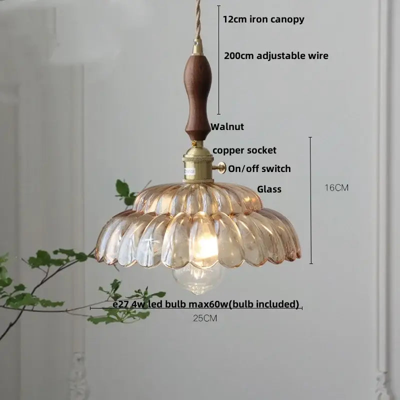 Amber flower glass pendant light with warm-toned petal-shaped glass, walnut wood canopy, and brass hardware for dining room